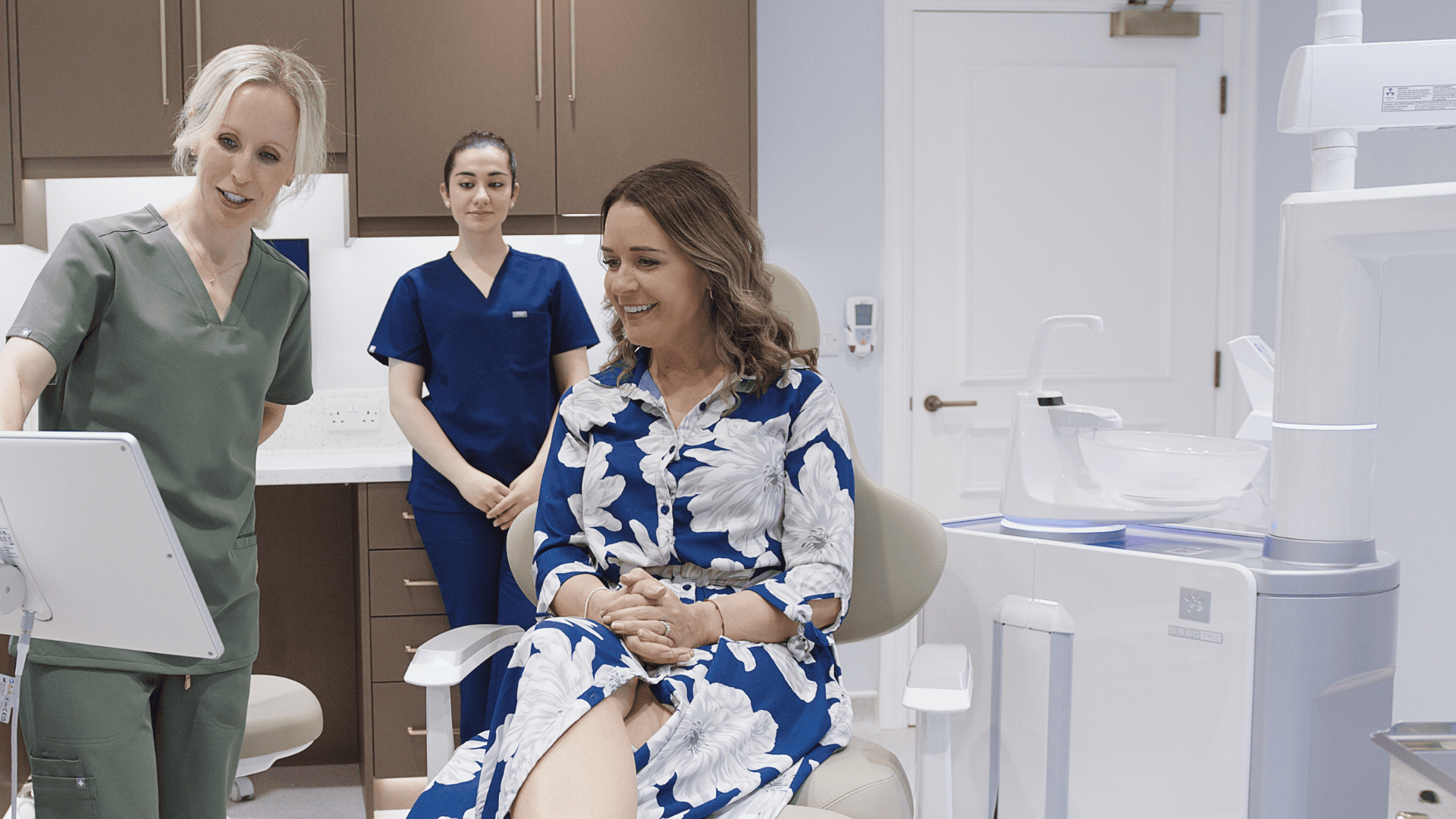 Patient receiving Invisalign treatment with digital scanner at Infinity Dental Clinic Leeds, expert providers of clear aligners.