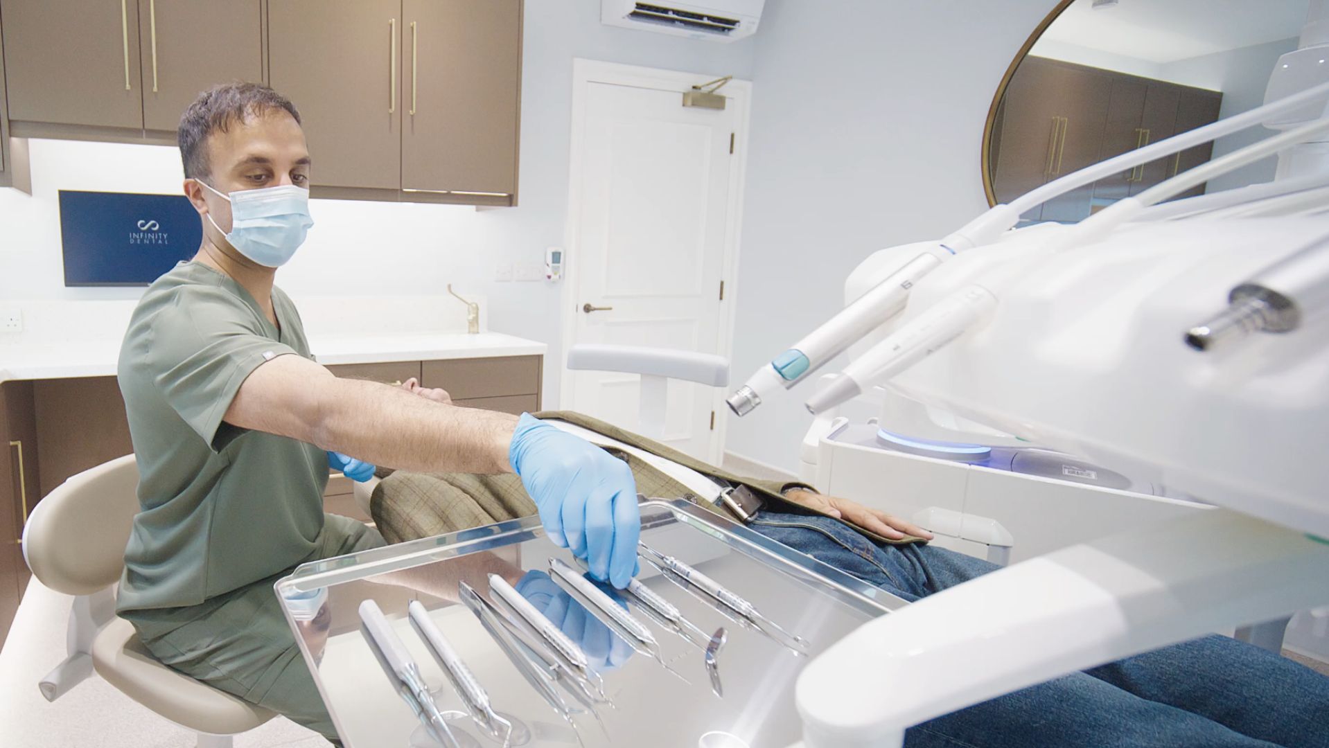 Dr Mohsin Patel performing Straumann dental implant surgery at Infinity Dental Clinic Leeds and Harrogate