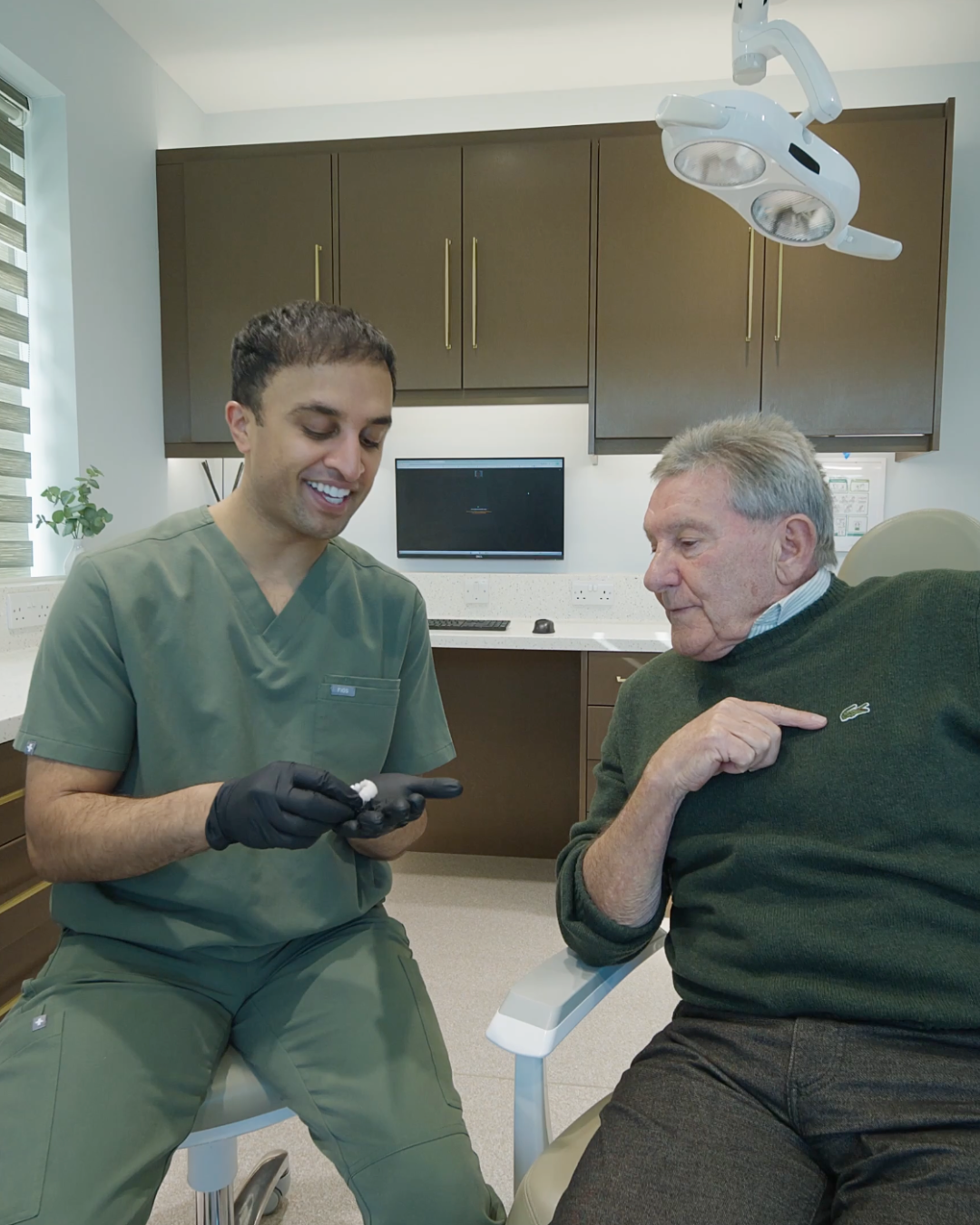Full Arch Dental Implants Leeds and Harrogate Dr Mohsin Patel consulting with patient about same day teeth dental implants in Leeds